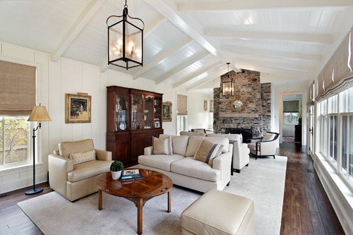 Long-Traditional-Long-Living-Room-with-Stone-Fireplace-by-Fieldcrest-Builders-Inc