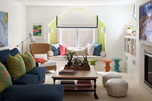 Fun-family-room-with-lime-green-walls-accent-wall-paint-color-alcove-built-in-window-seat-white-roman-shade-with-blue-trim-white-cushions