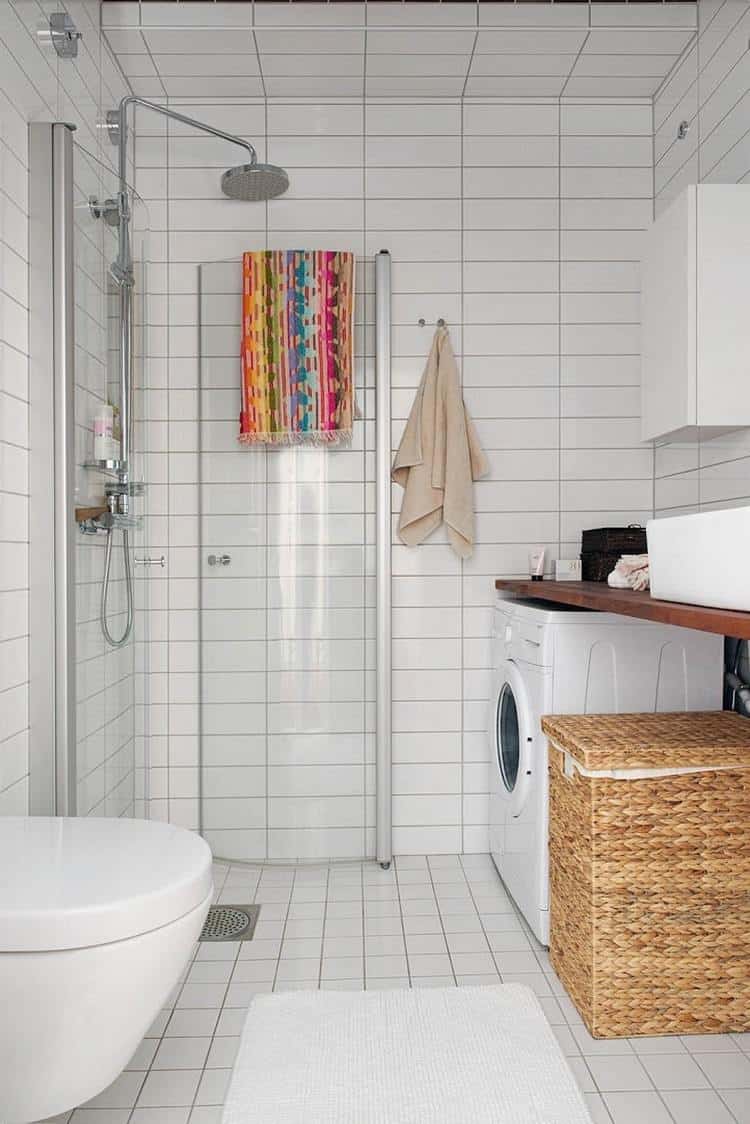 laundry area in the small Scandinavian bathroom