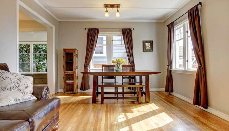 Dining-room-with-brown-curtain-and-hardwood-floor